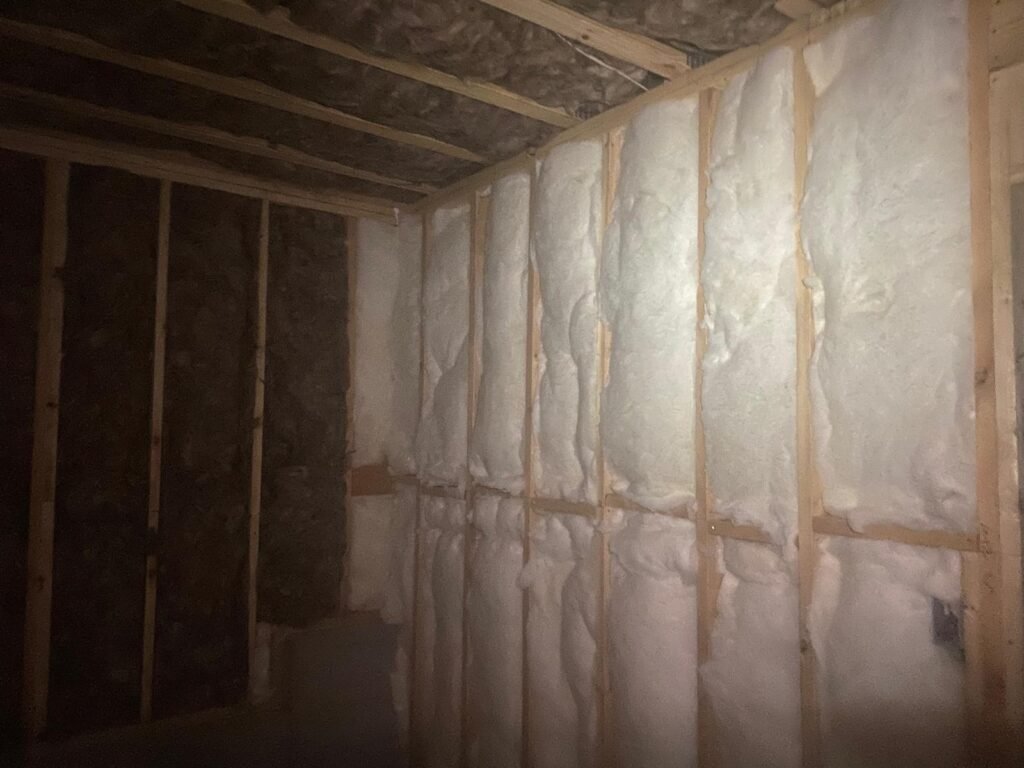 Professional fiberglass batt insulation installed in residential wall cavities by Brother's Foam Solution in Georgia.