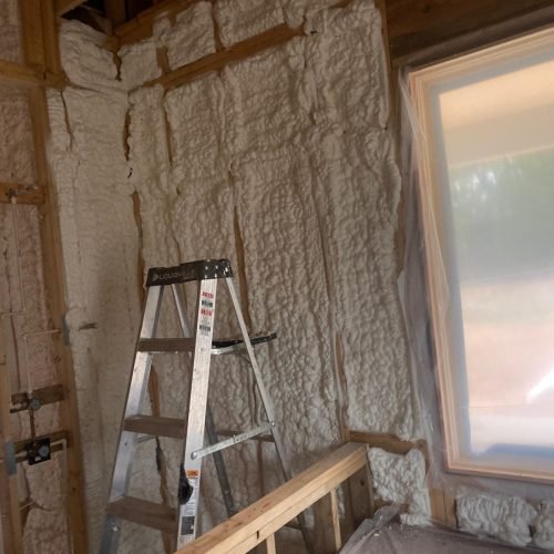 Professional sound mitigation insulation installed in interior walls to reduce noise transfer between rooms.