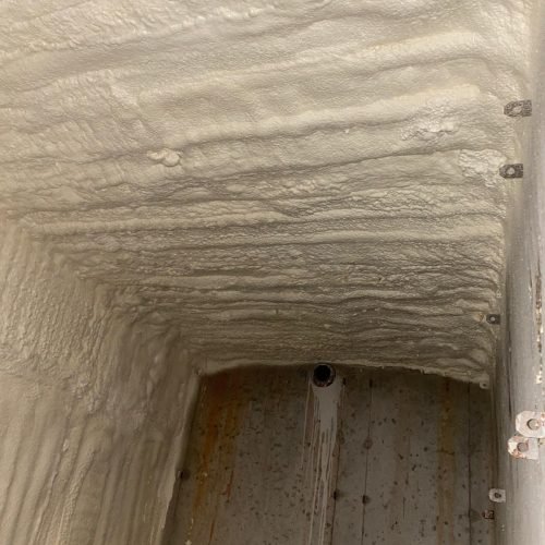 Attic air sealing process to improve home energy efficiency.