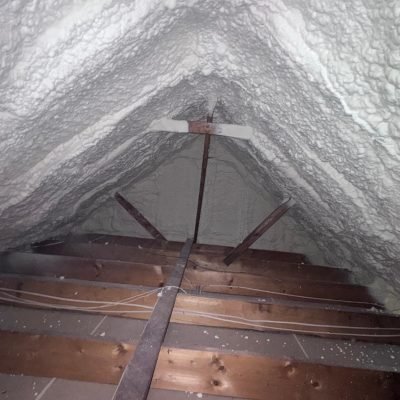 Seamless blanket of high-density blown-in insulation covering attic floor joists in a Georgia home.