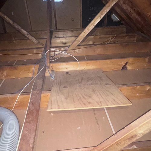 Seamless blanket of high-density blown-in insulation covering attic floor joists in a Georgia home.