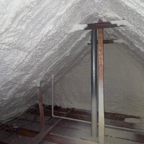 Precision blown-in insulation reaches tight corners and irregular spaces in residential attics.