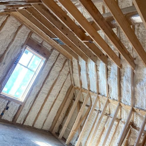 "Interior wall cavities filled with spray foam insulation for maximum soundproofing and efficiency.