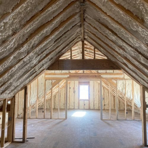 Residential attic spray foam insulation for superior thermal envelope in a new construction project.